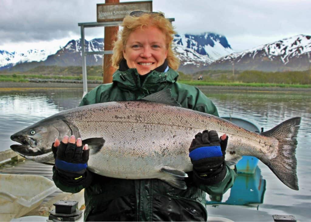 Lady holding large salmon