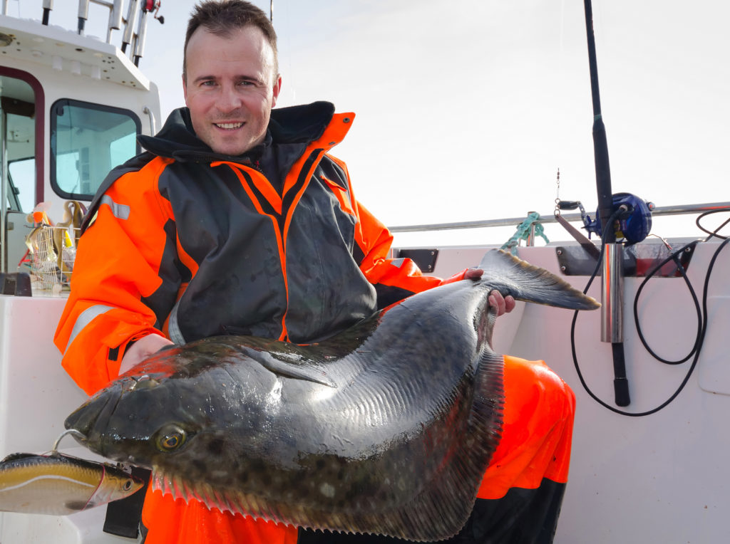 man,with,huge,halibut,fishing,trophy
