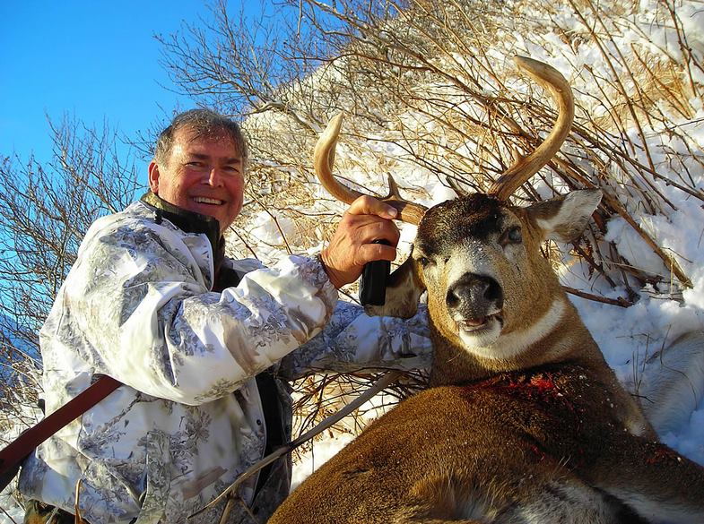 man with hunted deer
