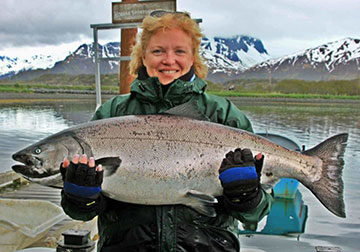 Lady holding large salmon